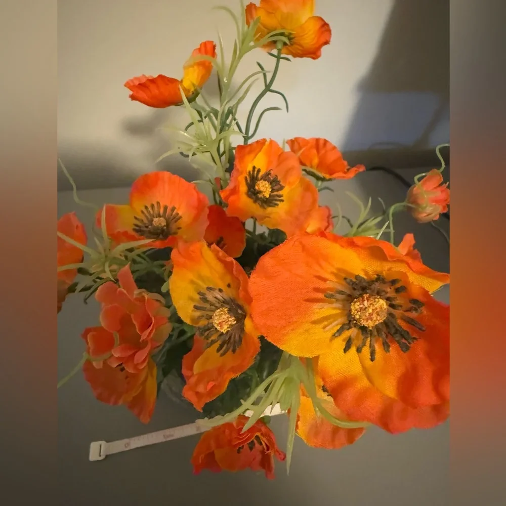 Vibrant Orange Floral Arrangement With Stone Holder